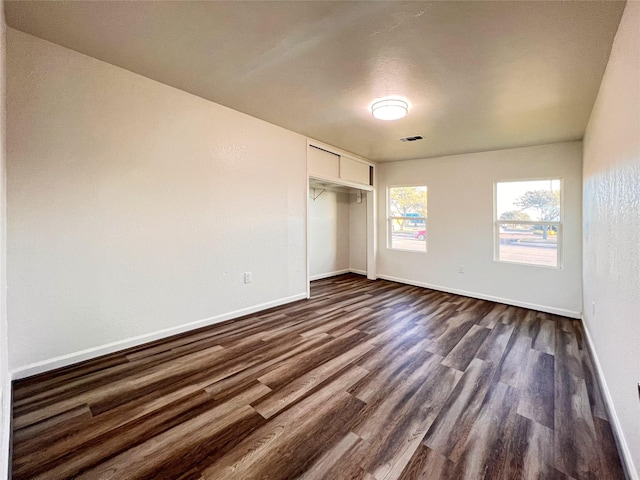 2328 Wimcrest St, Galveston, TX 77551 - unfurnished bedroom with dark wood-style floors and a closet