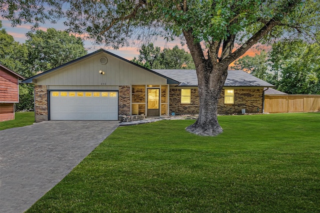 202 Twin Harbors Dr, Onalaska, TX 77360 - ranch-style house featuring decorative driveway, an attached garage, and brick siding
