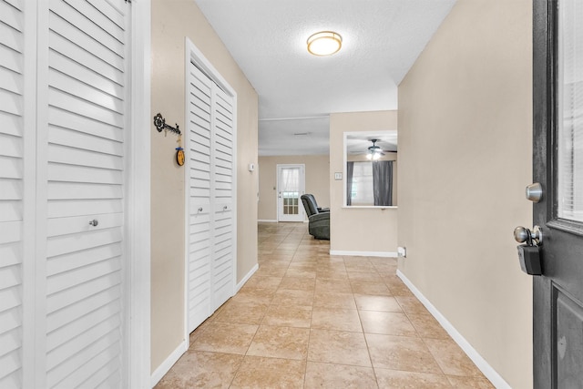 202 Twin Harbors Dr, Onalaska, TX 77360 - foyer with ceiling fan, a textured ceiling, and light tile patterned flooring
