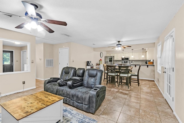 202 Twin Harbors Dr, Onalaska, TX 77360 - living room featuring a ceiling fan and light tile patterned floors