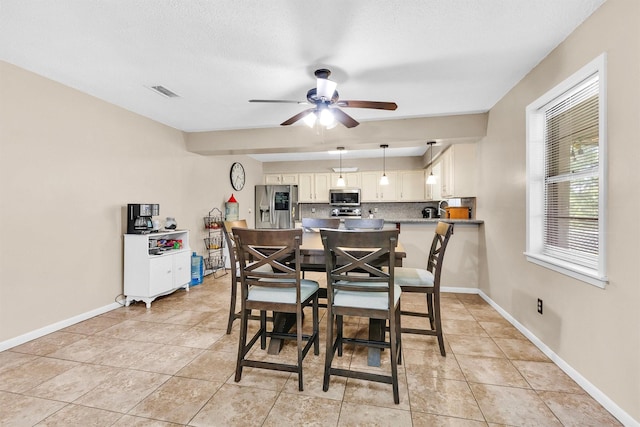202 Twin Harbors Dr, Onalaska, TX 77360 - dining room with a ceiling fan and light tile patterned floors