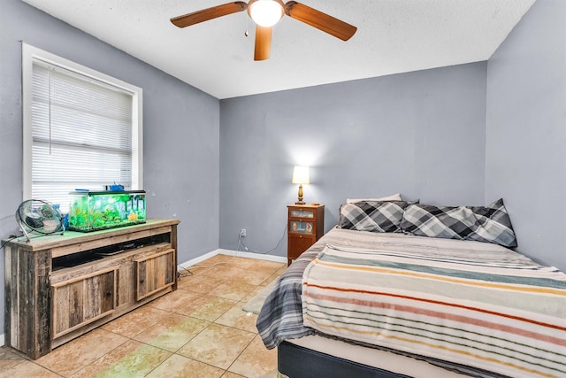 202 Twin Harbors Dr, Onalaska, TX 77360 - bedroom with light tile patterned floors and a ceiling fan