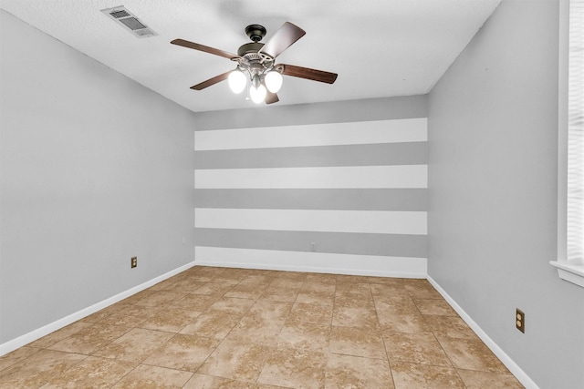 202 Twin Harbors Dr, Onalaska, TX 77360 - spare room featuring a ceiling fan and baseboards
