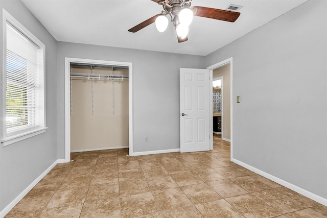 202 Twin Harbors Dr, Onalaska, TX 77360 - unfurnished bedroom featuring a closet and a ceiling fan
