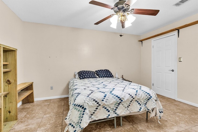 202 Twin Harbors Dr, Onalaska, TX 77360 - bedroom with light tile patterned flooring and a ceiling fan