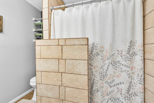 202 Twin Harbors Dr, Onalaska, TX 77360 - full bath featuring a shower with shower curtain, tile patterned flooring, and a textured ceiling