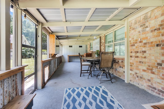 202 Twin Harbors Dr, Onalaska, TX 77360 - sunroom / solarium with carpet, healthy amount of natural light, and brick wall