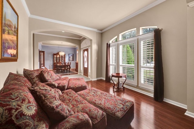 13603 Sand Mountain Ln, Houston, TX 77044 - living room featuring arched walkways, crown molding, and wood finished floors