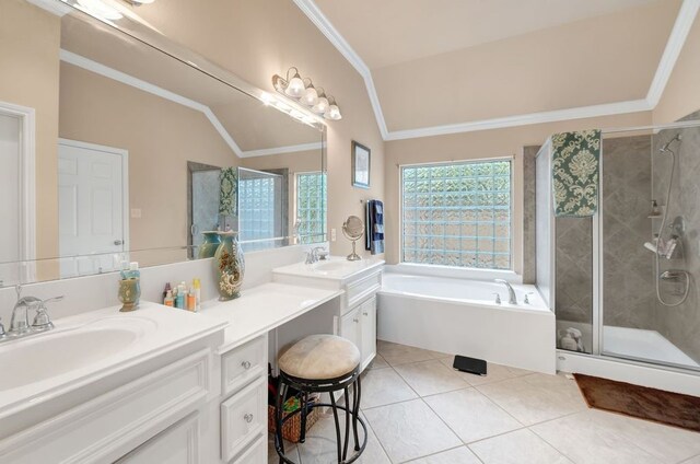13603 Sand Mountain Ln, Houston, TX 77044 - bathroom with double vanity, a bath, a stall shower, lofted ceiling, and tile patterned flooring