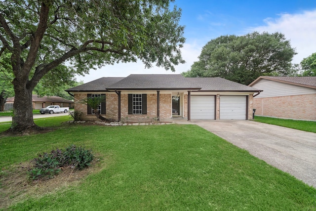 1617 Pecan Hollow St, Pearland, TX 77581 - single story home featuring a garage, driveway, brick siding, a front yard, and roof with shingles