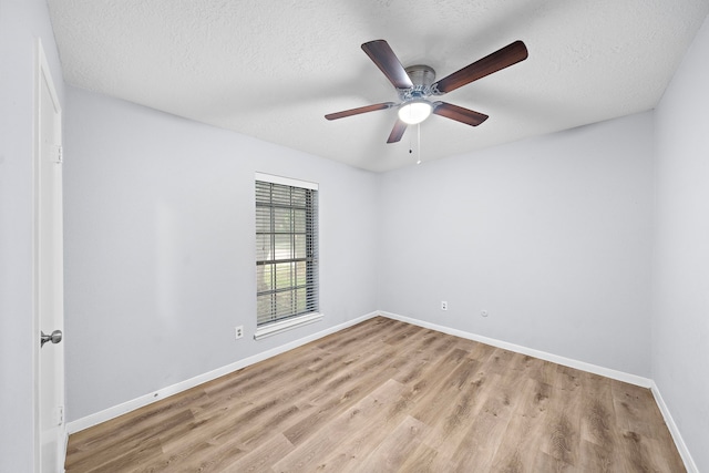 1617 Pecan Hollow St, Pearland, TX 77581 - spare room with wood finished floors, a ceiling fan, and a textured ceiling