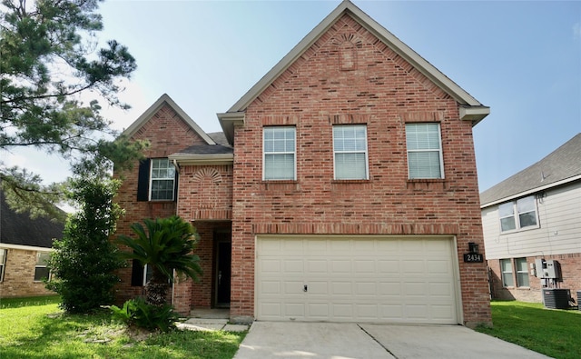 2434 Ranch Hollow Ct, Katy, TX 77494 - traditional-style house featuring brick siding, driveway, and a garage