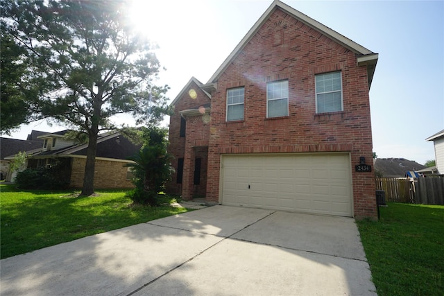 2434 Ranch Hollow Ct, Katy, TX 77494 - view of front facade featuring brick siding, concrete driveway, and an attached garage