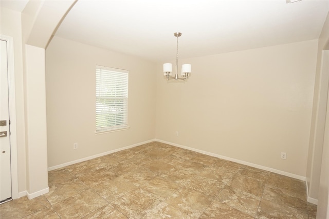 2434 Ranch Hollow Ct, Katy, TX 77494 - unfurnished room with arched walkways, stone finish flooring, and a chandelier