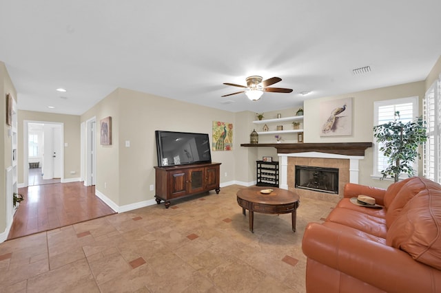 46 Lightwood Trce, The Woodlands, TX 77382 - living room featuring healthy amount of natural light, ceiling fan, a tile fireplace, and recessed lighting
