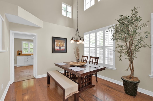 46 Lightwood Trce, The Woodlands, TX 77382 - dining room featuring a chandelier and hardwood / wood-style flooring