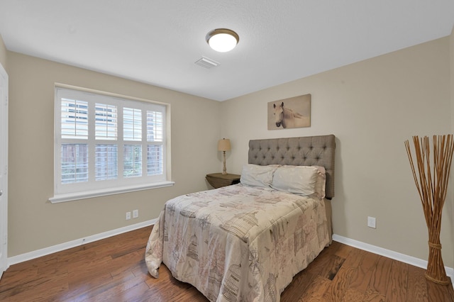 46 Lightwood Trce, The Woodlands, TX 77382 - bedroom featuring wood finished floors and baseboards