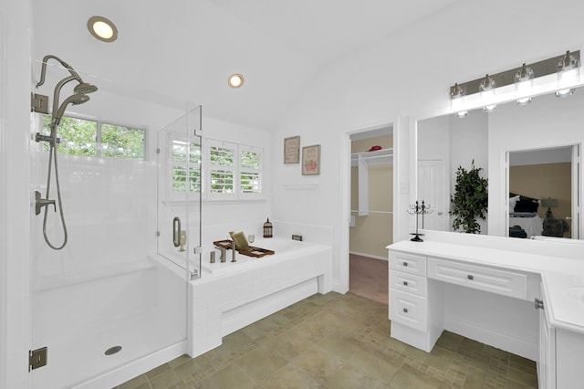 46 Lightwood Trce, The Woodlands, TX 77382 - bathroom with a stall shower, a garden tub, ensuite bathroom, lofted ceiling, and recessed lighting