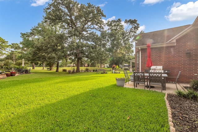 7710 Aerobic Ave, Humble, TX 77346 - view of green lawn with a patio