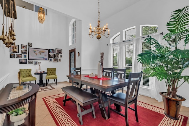 7710 Aerobic Ave, Humble, TX 77346 - dining room with a chandelier, light tile patterned flooring, and a towering ceiling