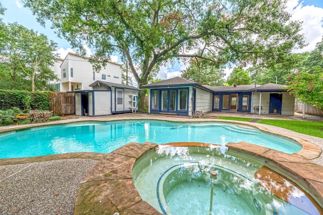 1226 Timbergrove Ln, Houston, TX 77008 - view of swimming pool with a pool with connected hot tub and a storage unit