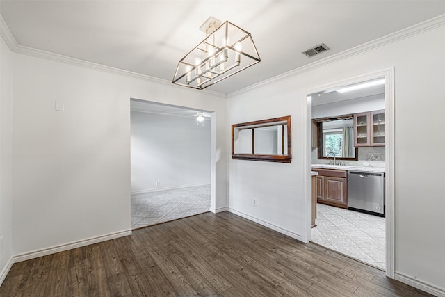 1226 Timbergrove Ln, Houston, TX 77008 - unfurnished dining area featuring wood finished floors, ornamental molding, and a chandelier