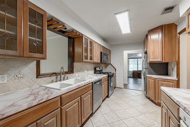 1226 Timbergrove Ln, Houston, TX 77008 - kitchen with appliances with stainless steel finishes, light countertops, glass insert cabinets, backsplash, and light tile patterned floors