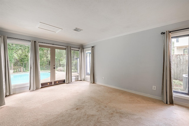1226 Timbergrove Ln, Houston, TX 77008 - empty room featuring carpet flooring, french doors, crown molding, and attic access
