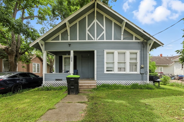 208 S Cloud St, Wharton, TX 77488 - view of front of property with covered porch and a front yard