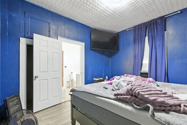 208 S Cloud St, Wharton, TX 77488 - bedroom with light wood-style floors and ensuite bathroom