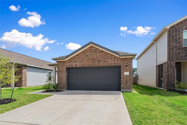 10138 California Lily Ln, Houston, TX 77016 - ranch-style house featuring a front lawn, brick siding, and driveway