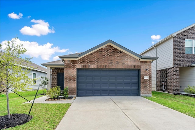10138 California Lily Ln, Houston, TX 77016 - view of front of home featuring driveway, brick siding, a front yard, and an attached garage