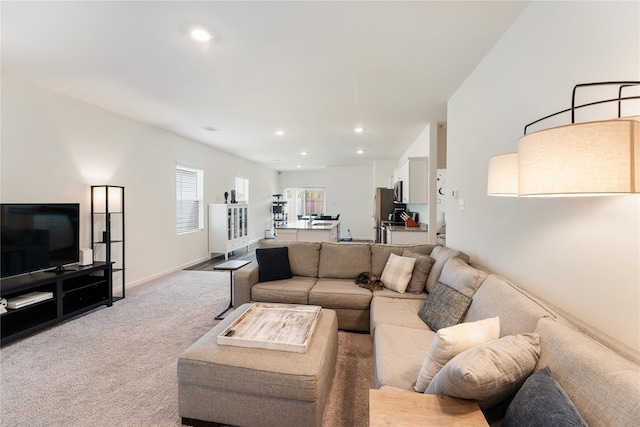 10138 California Lily Ln, Houston, TX 77016 - living room featuring light carpet and recessed lighting