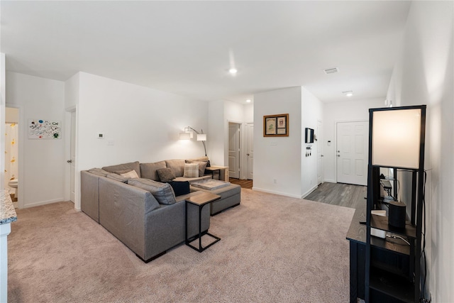 10138 California Lily Ln, Houston, TX 77016 - living area featuring carpet flooring and recessed lighting