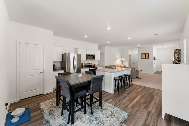 10138 California Lily Ln, Houston, TX 77016 - dining space featuring wood finished floors and recessed lighting