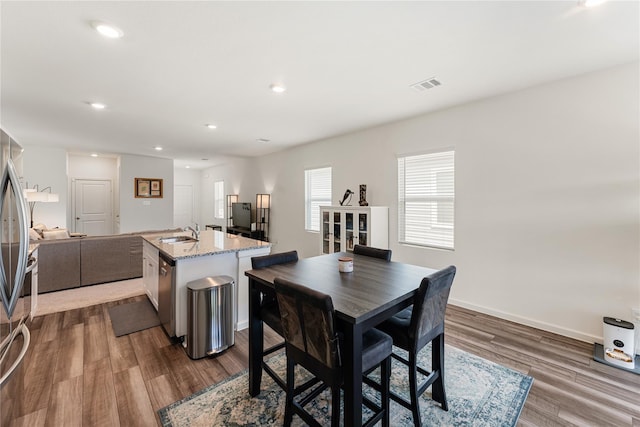 10138 California Lily Ln, Houston, TX 77016 - dining room with dark wood-type flooring and recessed lighting