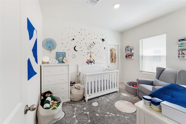 10138 California Lily Ln, Houston, TX 77016 - bedroom featuring carpet flooring and a crib