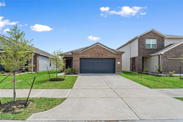 10138 California Lily Ln, Houston, TX 77016 - view of front of property featuring an attached garage, driveway, a front yard, and brick siding