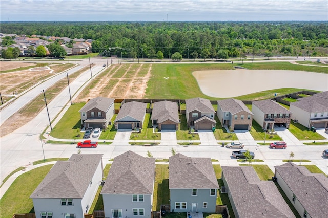 10138 California Lily Ln, Houston, TX 77016 - aerial perspective of suburban area with a forest