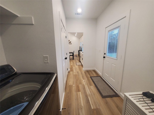 95 Red Tip Ln, Brenham, TX 77833 - laundry room with washer / dryer and light wood-type flooring