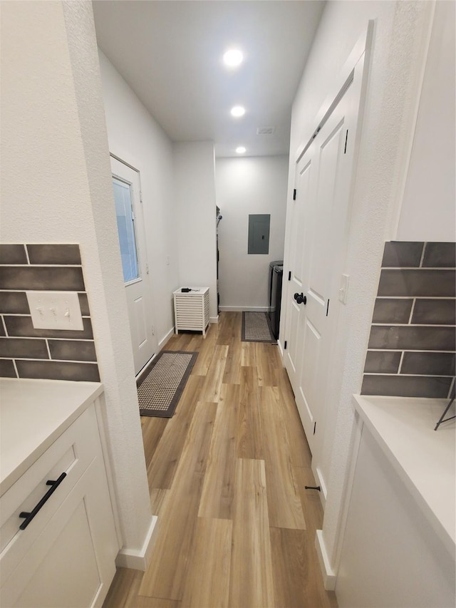 95 Red Tip Ln, Brenham, TX 77833 - hallway with electric panel, light wood-style flooring, and recessed lighting