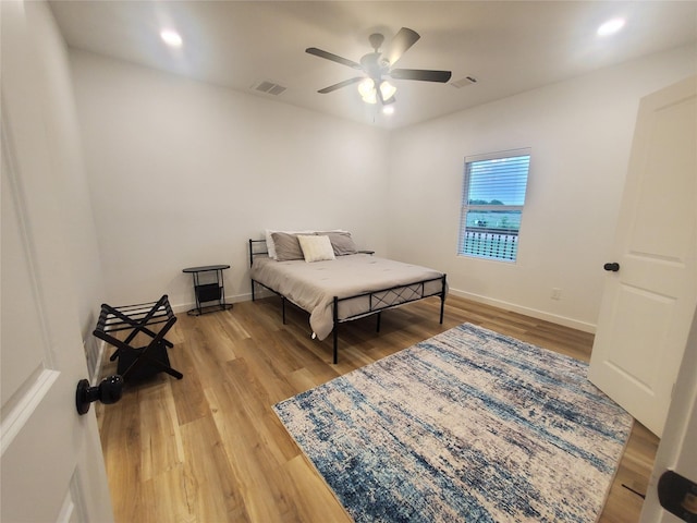 95 Red Tip Ln, Brenham, TX 77833 - bedroom with light wood-style floors, a ceiling fan, and recessed lighting