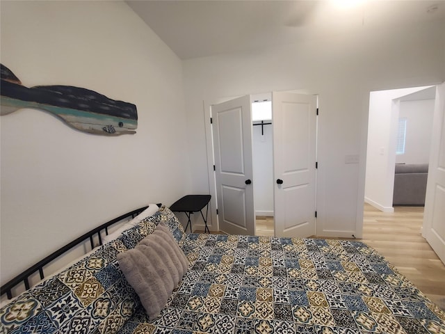 95 Red Tip Ln, Brenham, TX 77833 - bedroom with light wood-type flooring and baseboards