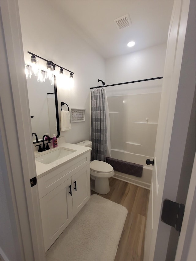 95 Red Tip Ln, Brenham, TX 77833 - bathroom featuring vanity, shower / tub combo, and wood finished floors