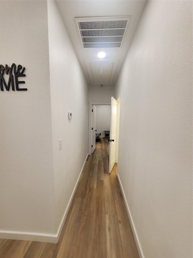 95 Red Tip Ln, Brenham, TX 77833 - hall featuring attic access and wood finished floors