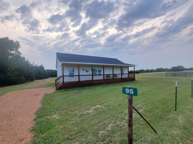 95 Red Tip Ln, Brenham, TX 77833 - farmhouse-style home with a wooden deck