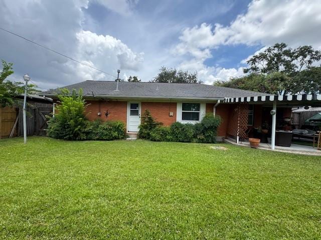 6515 Lindyann Ln, Houston, TX 77008 - rear view of house with a patio and brick siding