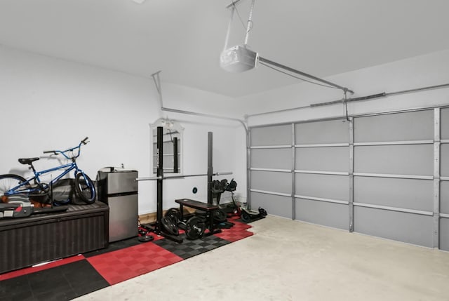 734 W Donovan St, Houston, TX 77091 - garage with a garage door opener and freestanding refrigerator