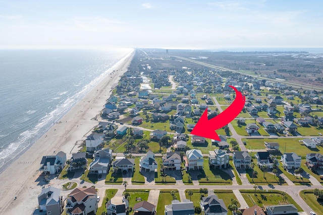 4211 Surf Dr, Galveston, TX 77554 - aerial view of property's location with nearby suburban area and waterfront with a beach