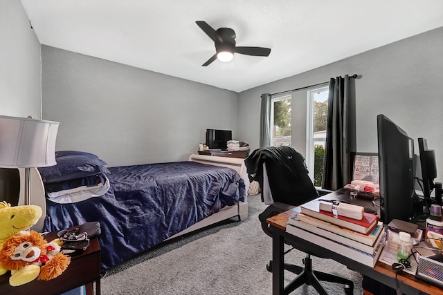 7530 Deep Forest Dr, Houston, TX 77088 - carpeted bedroom with a desk and a ceiling fan